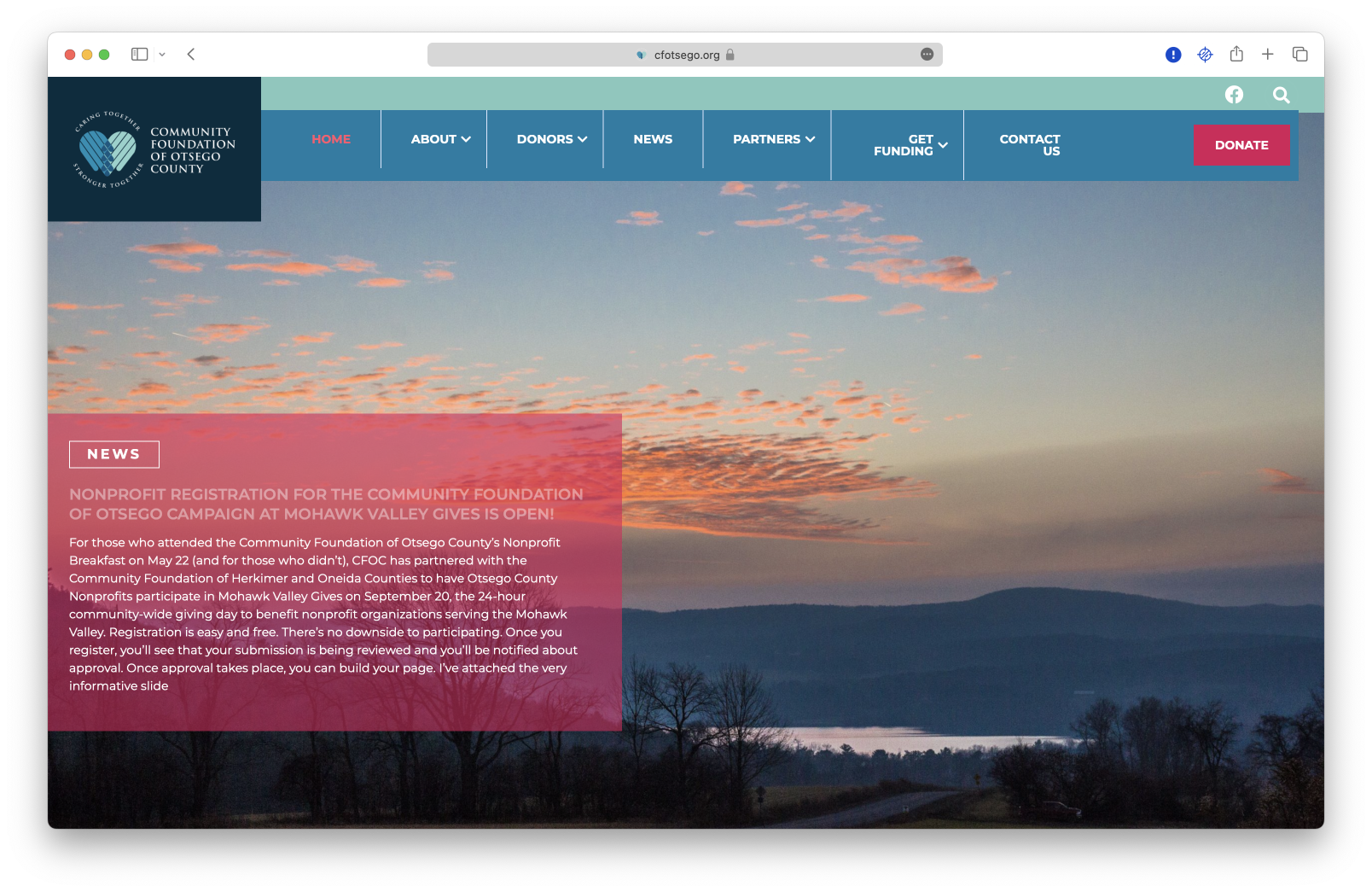 A website screenshot featuring the Community Foundation of Otsego County with a sunset background.