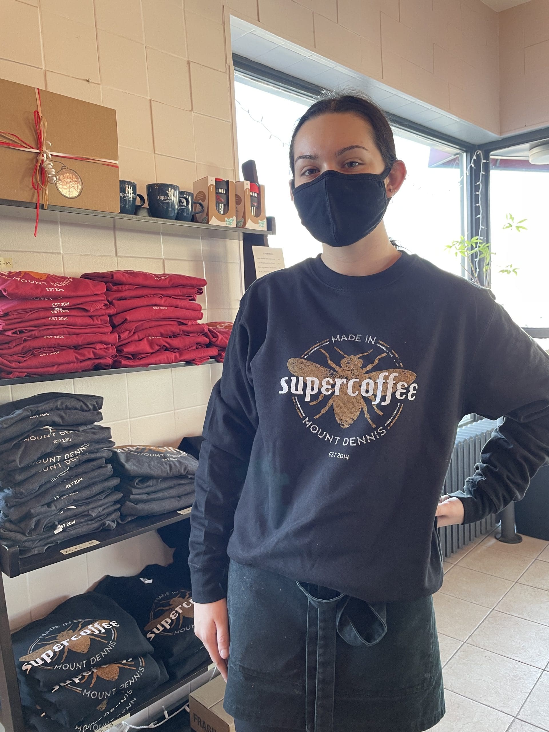 A Supercoffee employee modeling new Supercoffee clothing.